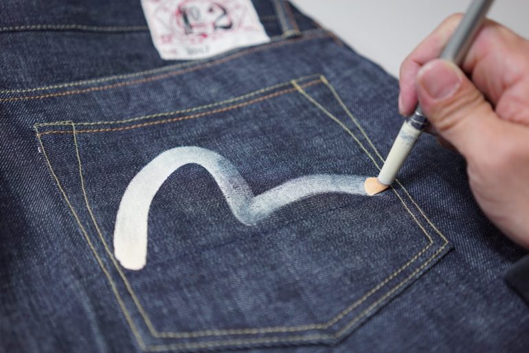 Hand-drawing seagull arcuate on Evisu raw denim jeans